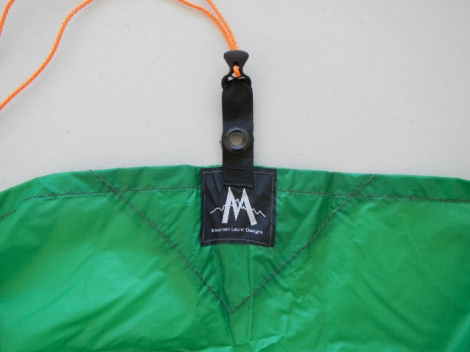 Center long side tie out on one side has webbing with a grommet for trekking pole tip